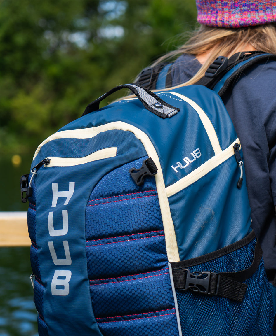 HUUB TT Bag – Transition Three, 40L rucksack, wet/dry, hidden helmet cradle, navy and olive/orange.